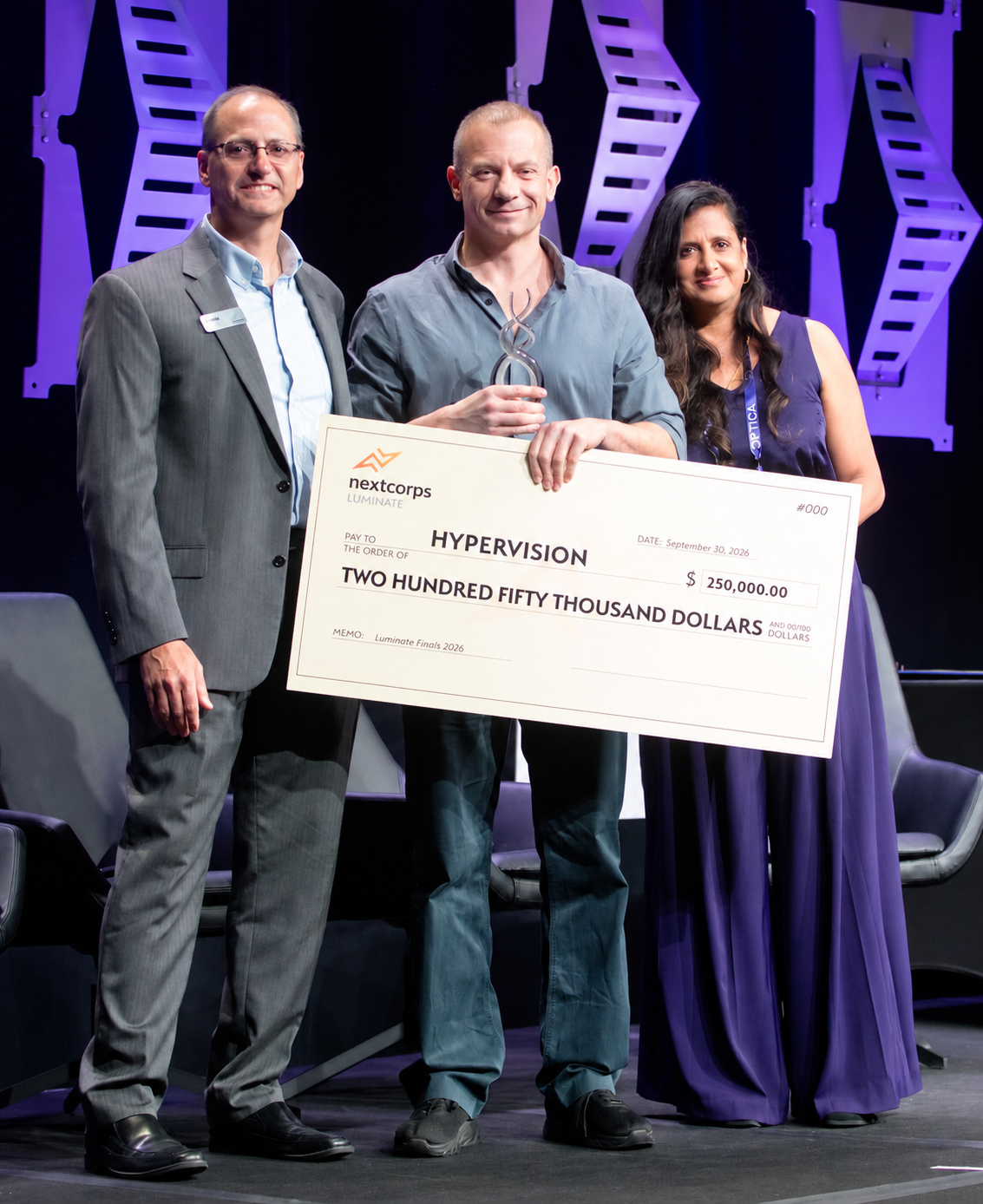 Hypervision at the Luminate Finals 2026 award ceremony, holding the trophy and $250,000 check